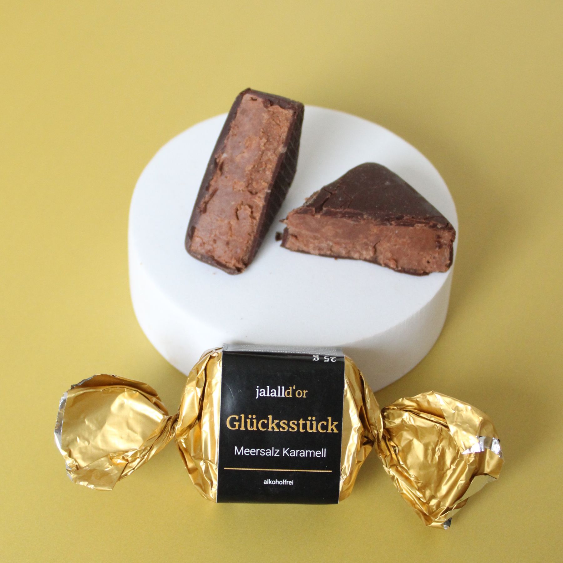 Gluecksstueck Sanddorn Orange ganze Verpackung und dahinter aufgeschnitten