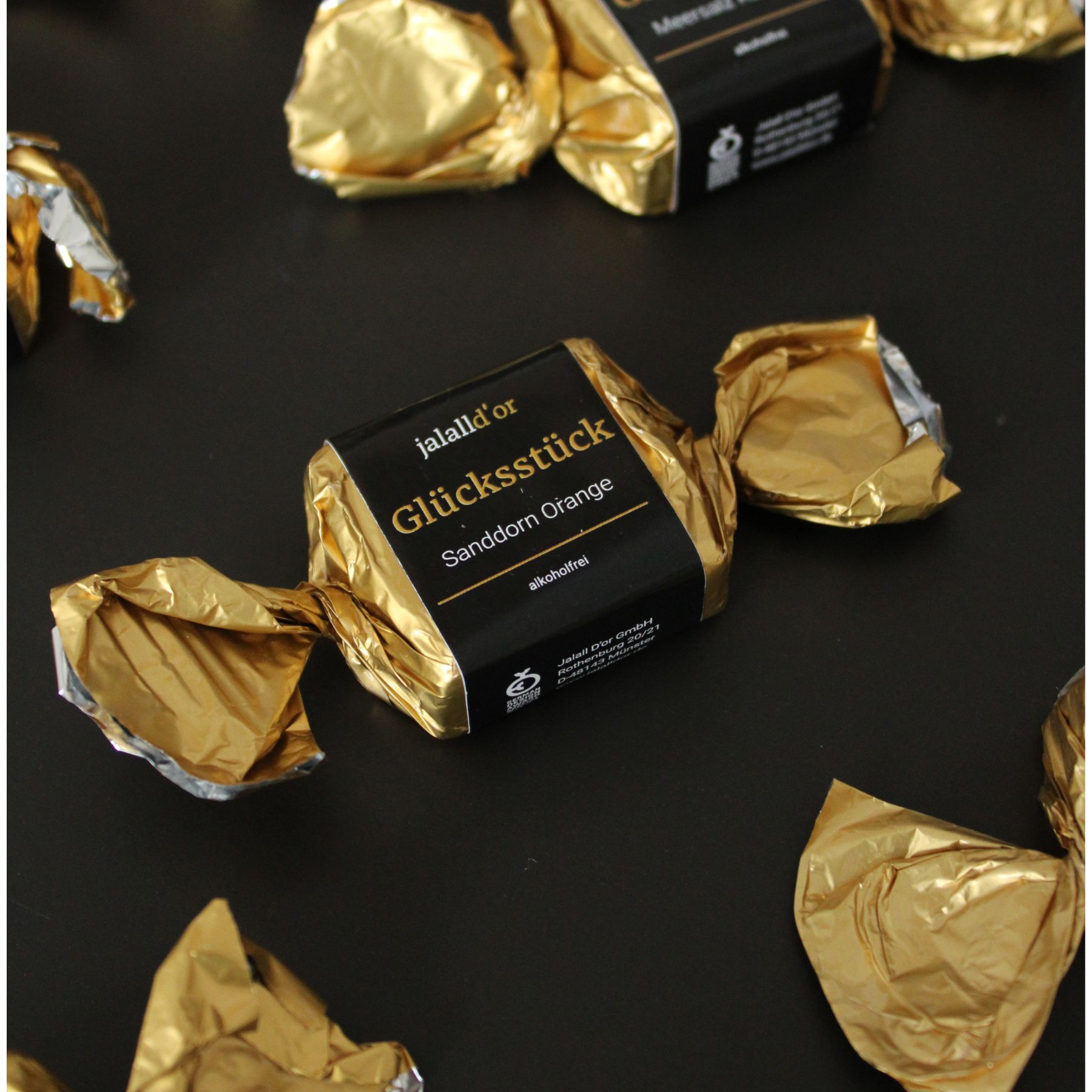 Gluecksstueck Sanddorn Orange mehrere Verpackungen nebeneinander